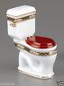No, it's not a real toilet. It's a porcelain miniature.